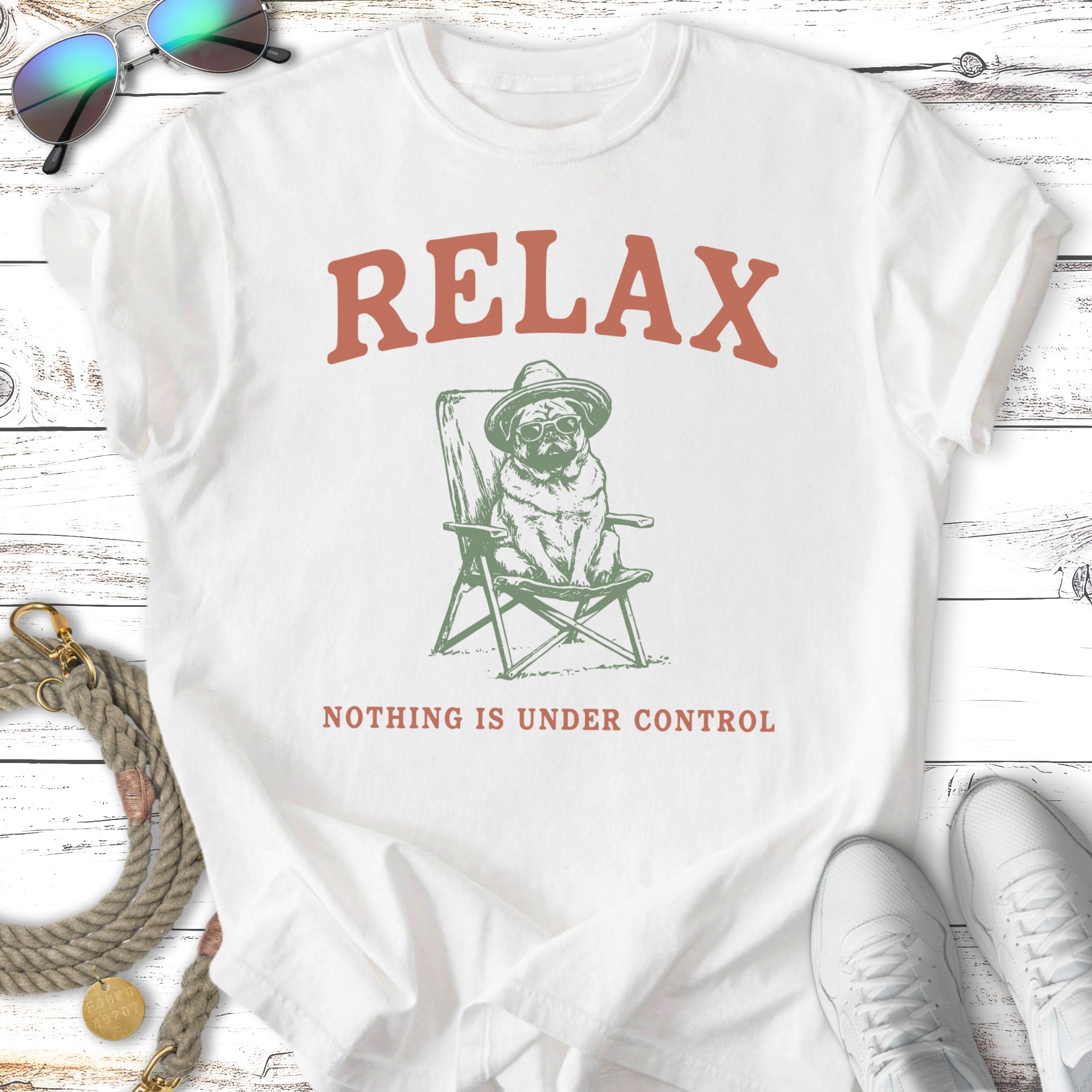 Pug wearing sunglasses and hat in a lawn chair, "RELAX NOTHING IS UNDER CONTROL" text.