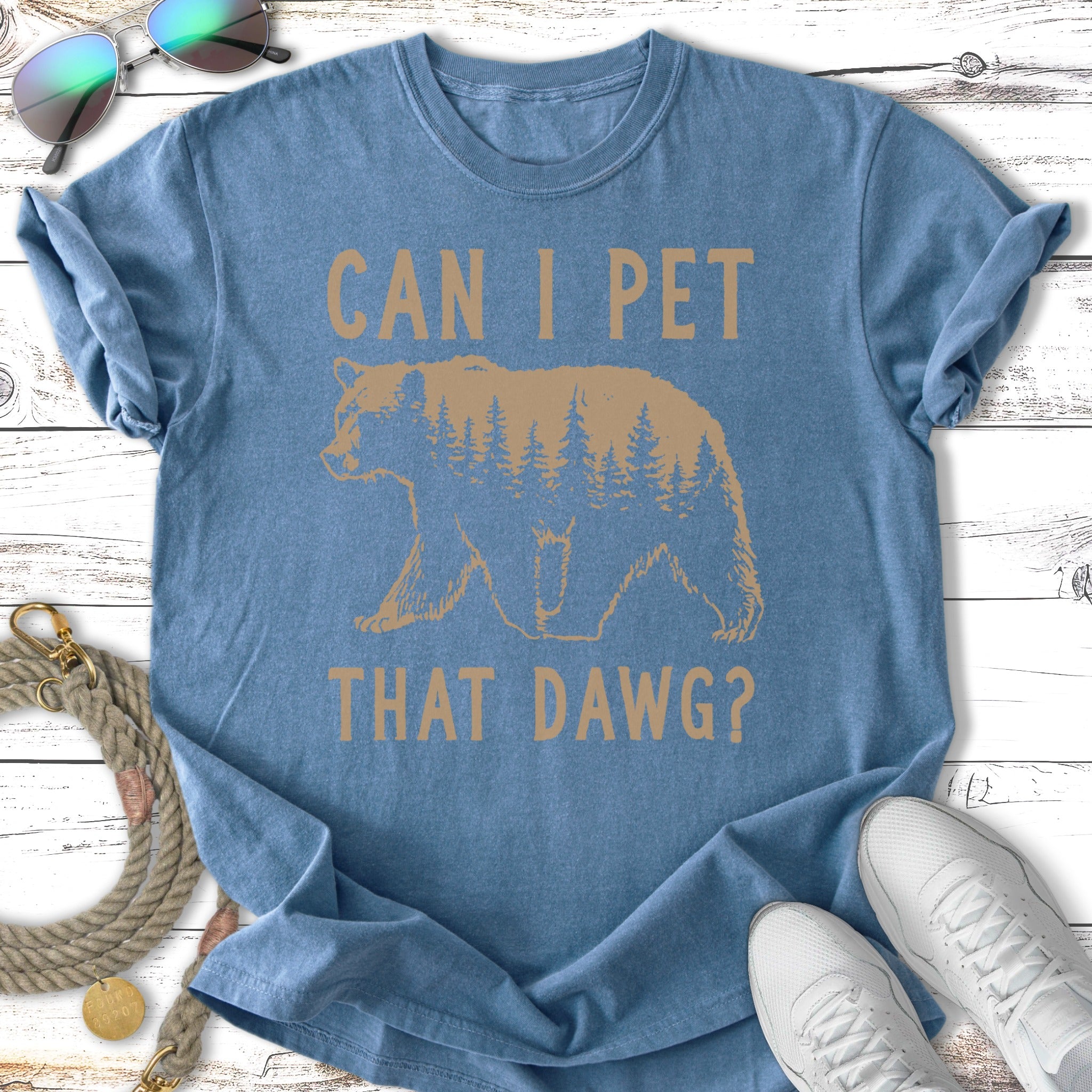 T-shirt with a bear silhouette filled with pine trees and text "CAN I PET THAT DAW"?