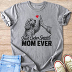 Grey t-shirt with a drawing of a Cocker Spaniel giving a high five and the text "Best Cocker Spaniel Mom Ever".