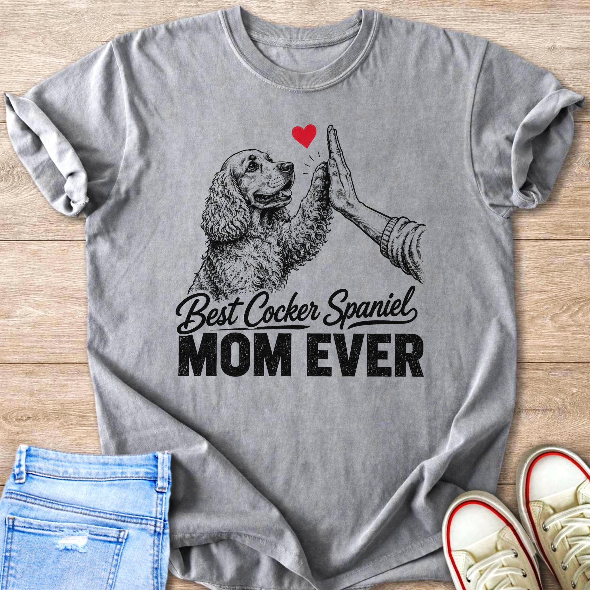 Grey t-shirt with a drawing of a Cocker Spaniel giving a high five and the text "Best Cocker Spaniel Mom Ever".