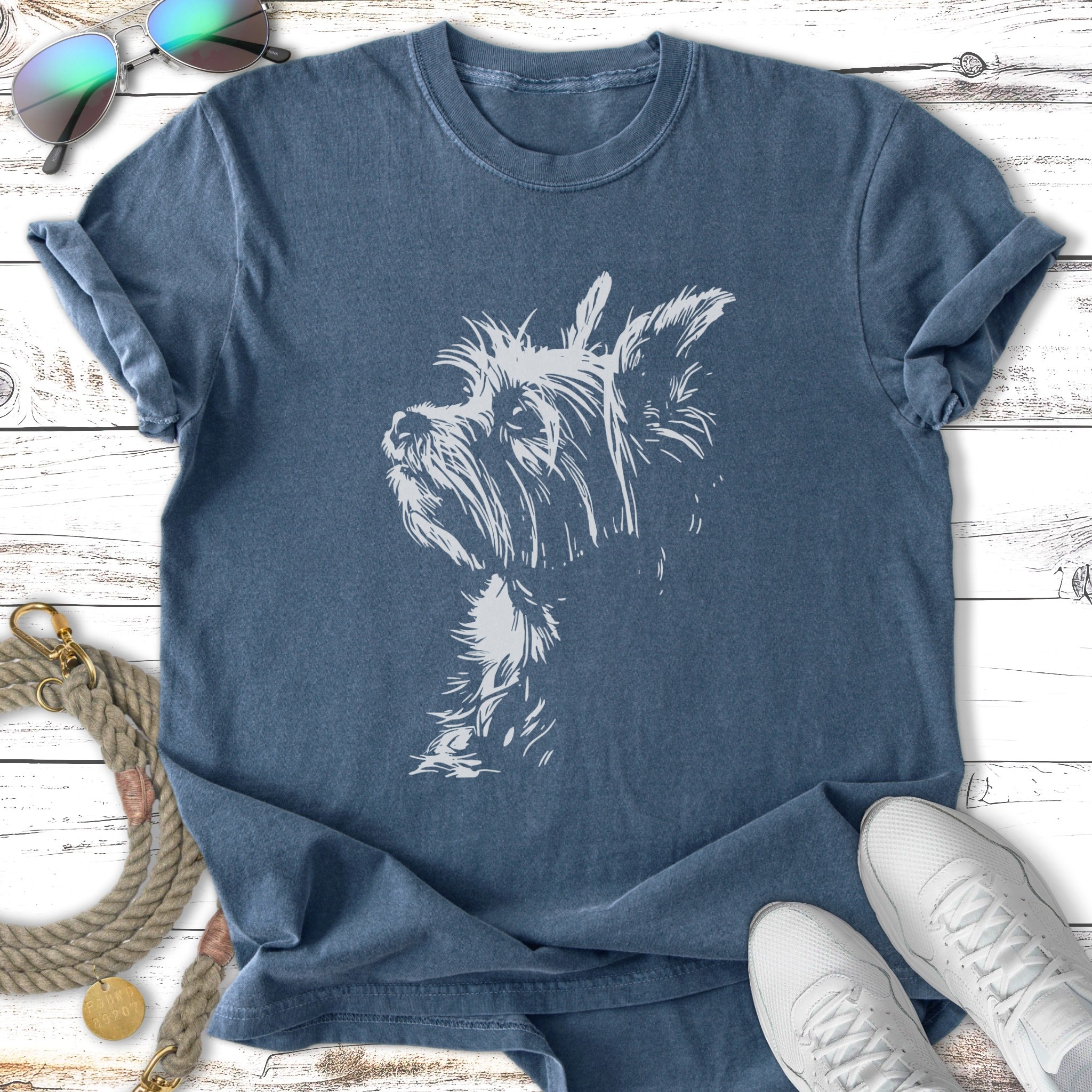 T-shirt with a white outline sketch of a Yorkshire Terrier dog.