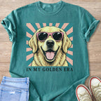Golden retriever wearing pink sunglasses with text "IN MY GOLDEN ERA".
