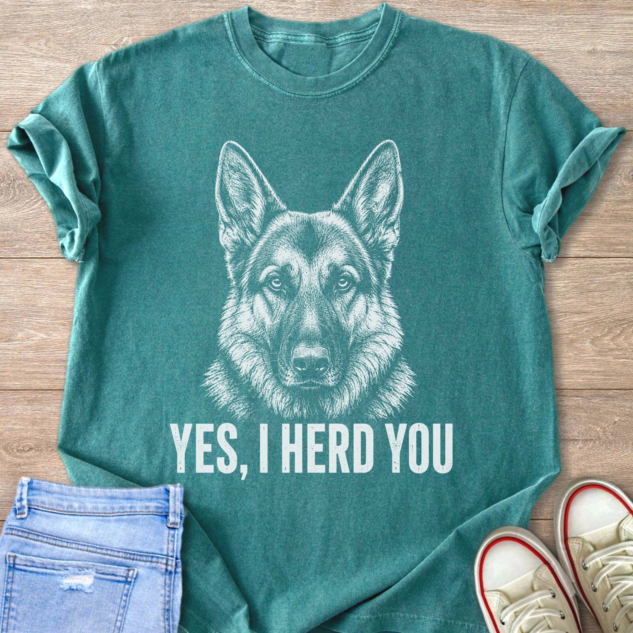 Teal t-shirt with a white sketch of a German Shepherd and the text "YES, I HERD YOU".
