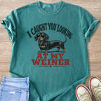 Teal t-shirt with dachshund in sunglasses, text: I caught you looking at my wiener.