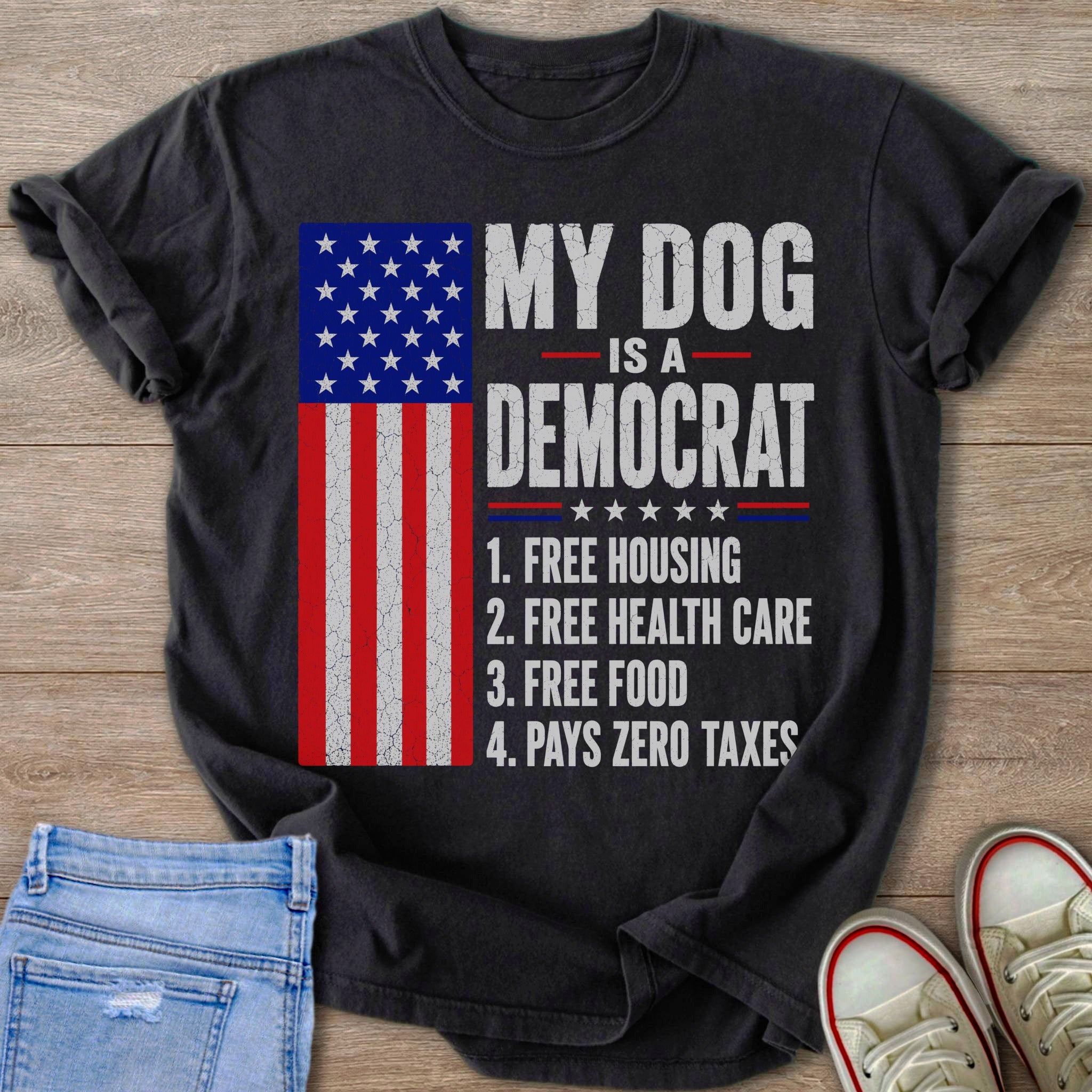 Dark t-shirt with American flag and text "My dog is a democrat" listing four benefits.