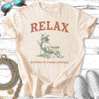 Cream t-shirt with "RELAX NOTHING IS UNDER CONTROL" and a dog in a lounge chair.