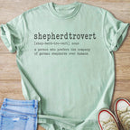 Mint t-shirt with "shepherdtrovert: a person who prefers the company of german shepherds over humans" text.