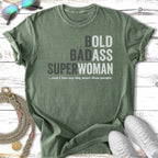 Green t-shirt with "BOLD BADASS SUPERWOMAN" and dog quote.