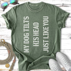 Green t-shirt with "MY DOG TILTS HIS HEAD JUST LIKE YOU" text.