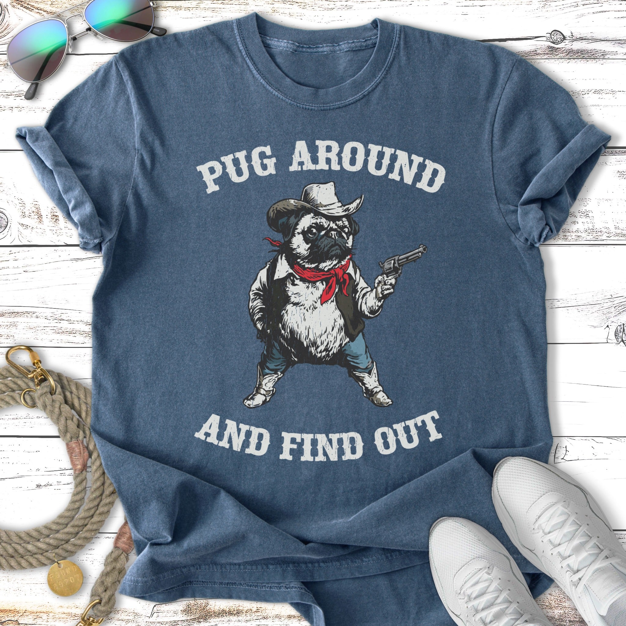 Pug wearing cowboy hat and holding gun, with text "Pug Around and Find Out".