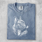 French Bulldog with dandelion on a faded blue t-shirt.