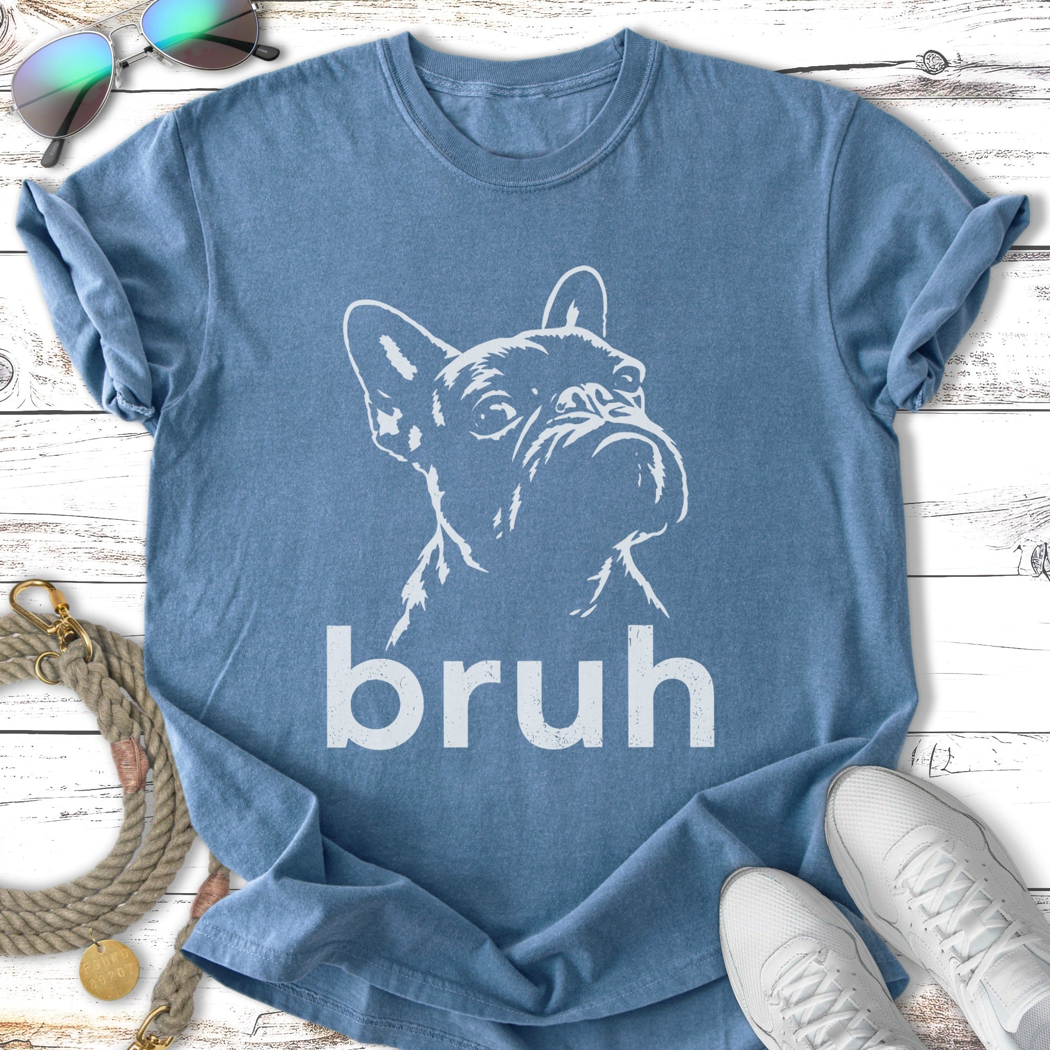 French Bulldog outline graphic on blue t-shirt with "bruh" text.