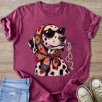 Dalmatian dog wearing sunglasses and crochet bandana holds crochet hook with yarn.