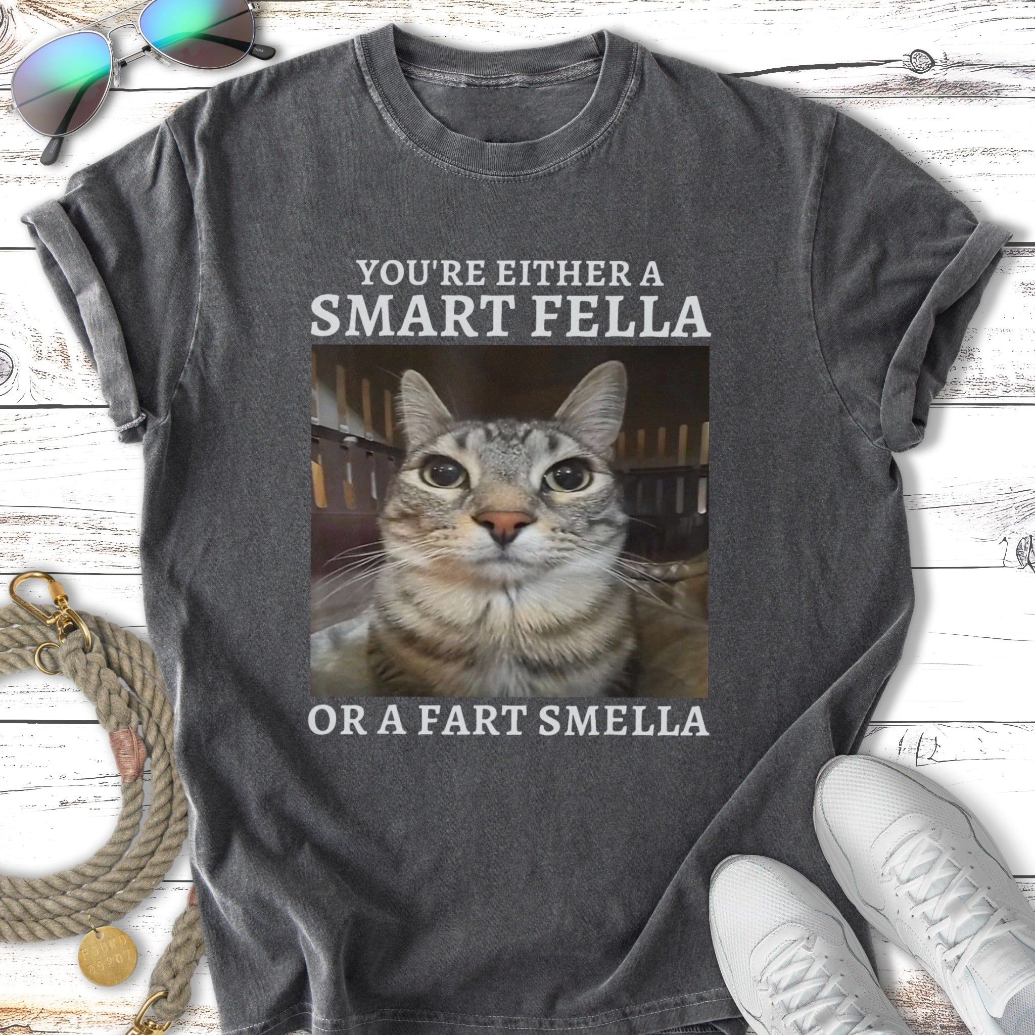 T-shirt with cat photo and text: "You're either a smart fella or a fart smella."