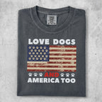 Dark gray t-shirt with "LOVE DOGS AND AMERICA TOO" text and paw print flag.