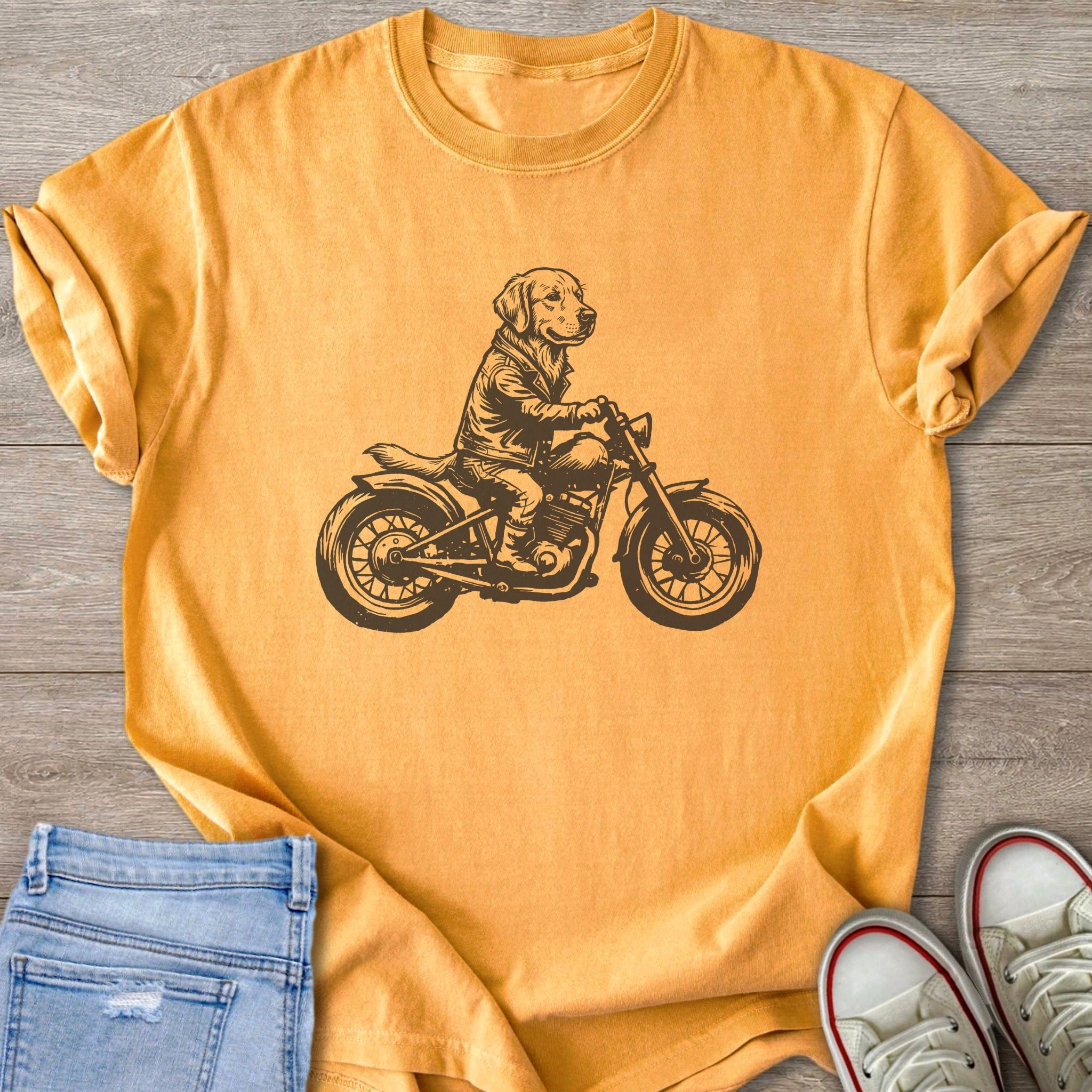 T-shirt with dark brown graphic of a dog wearing a leather jacket riding a motorcycle.