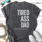 T-shirt with "Retired Badass Dog Dad" text and a dog tag.