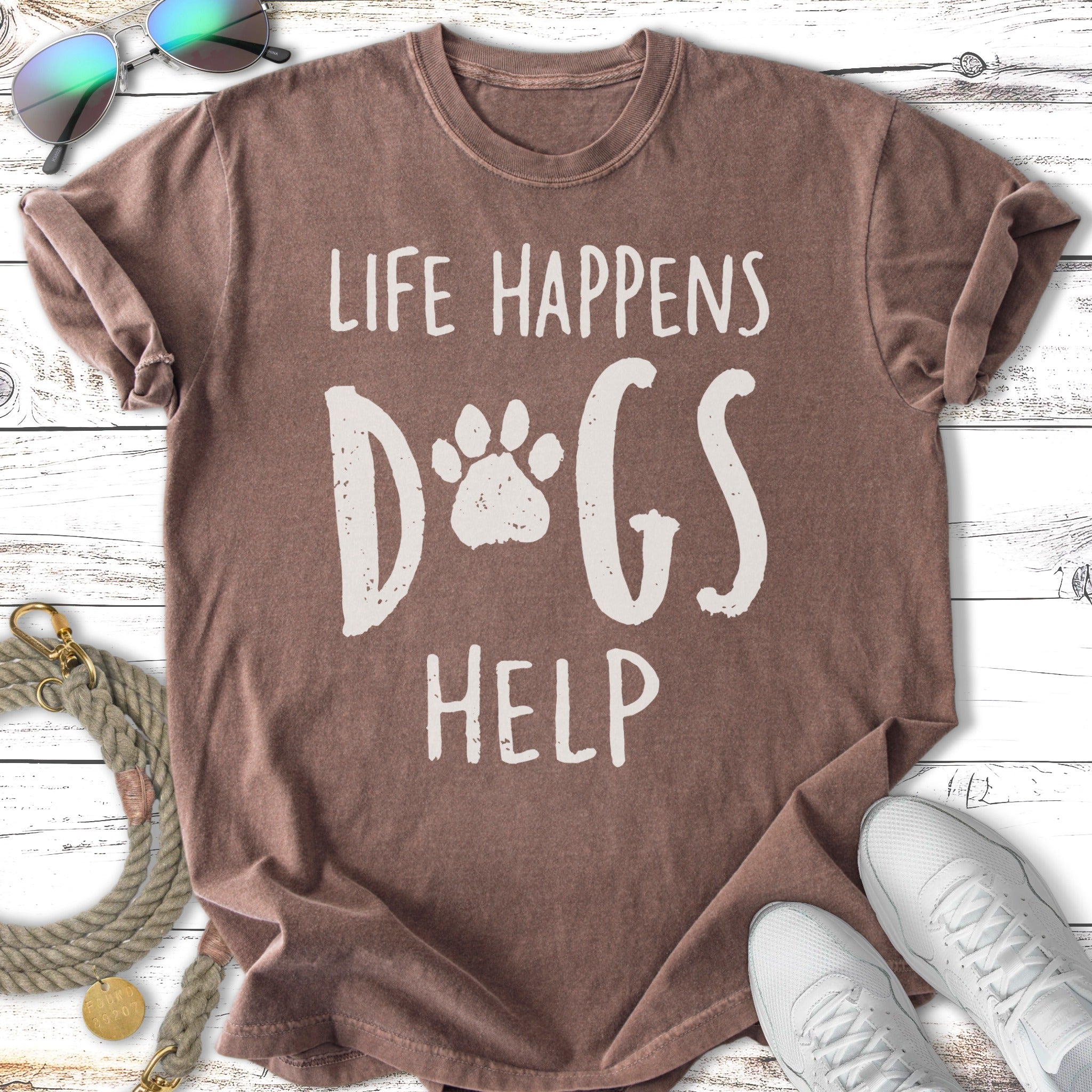 Brown t-shirt with "Life Happens Dogs Help" and paw print graphic.