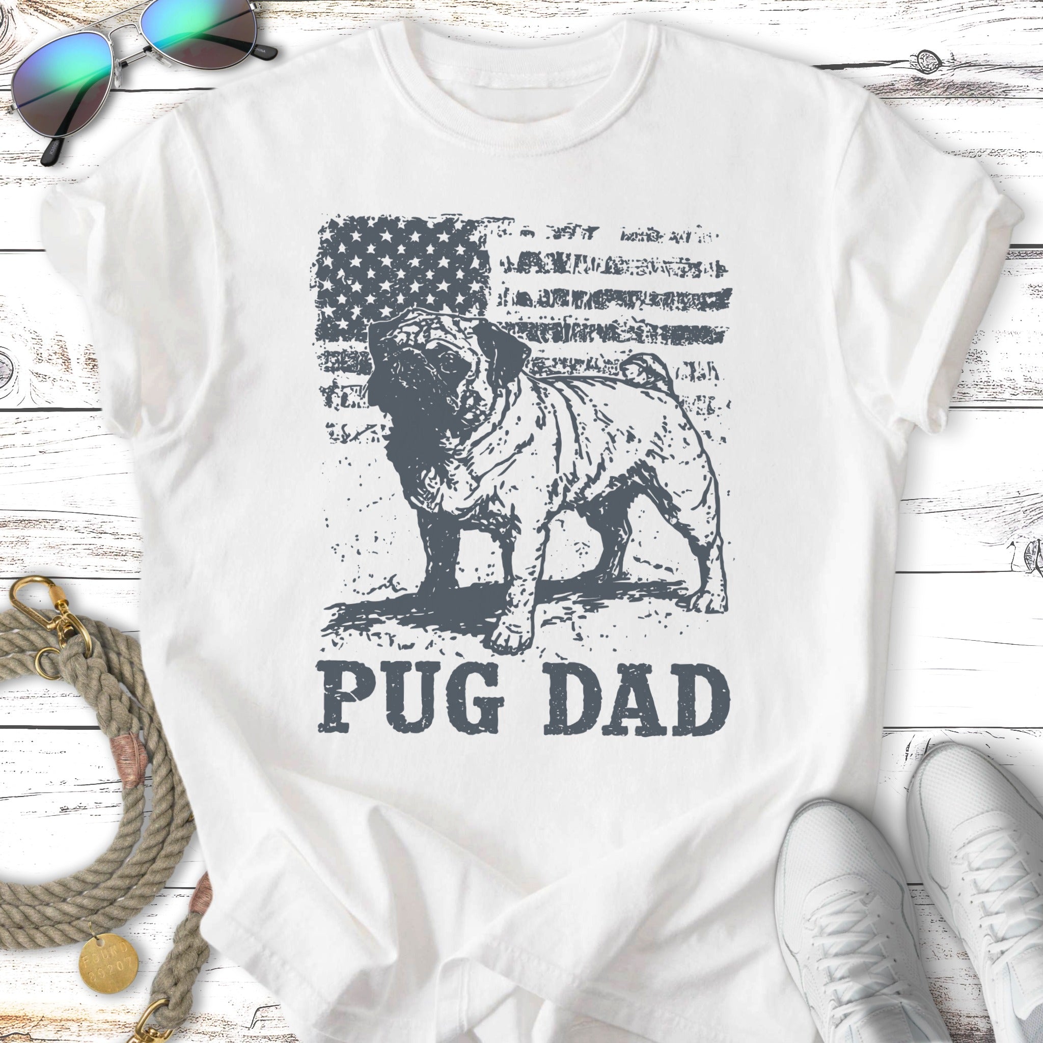 Distressed American flag with pug graphic and "Pug Dad" text on a white t-shirt.