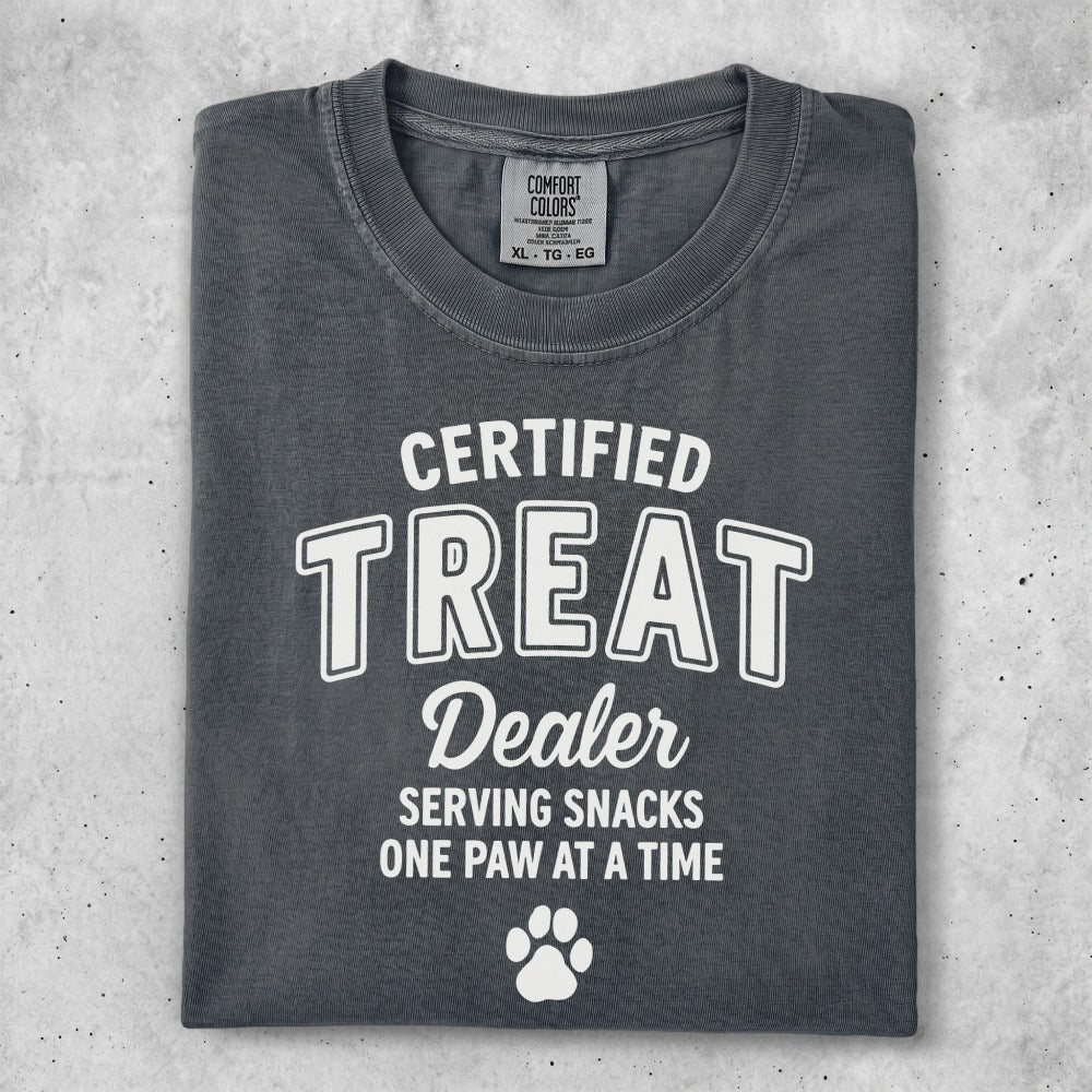 Comfort Colors t-shirt with "Certified Treat Dealer" text and paw print.
