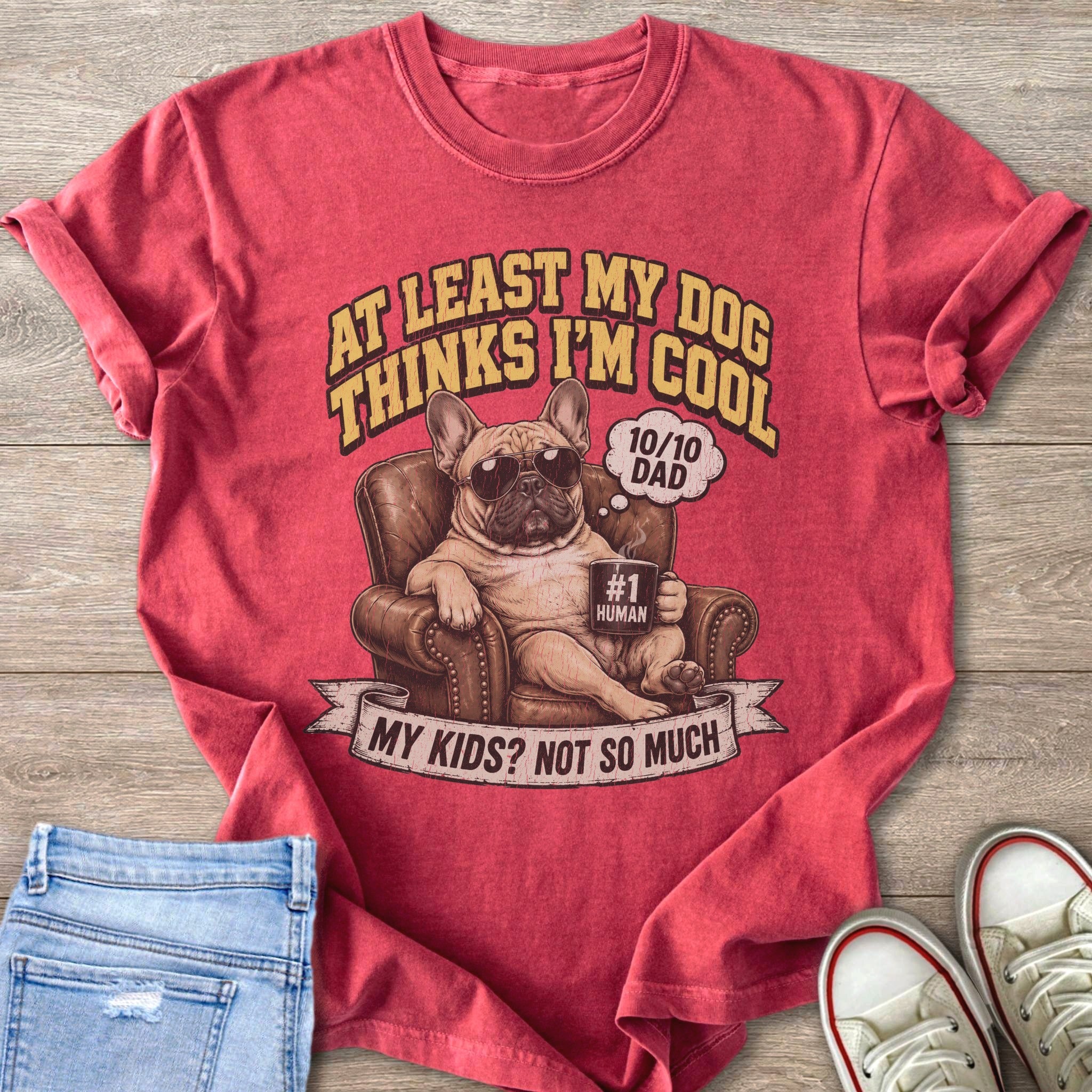 French bulldog in sunglasses sits in a chair with a mug labeled "#1 Human".