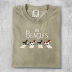 The Beatles Abbey Road album cover art on a beige t-shirt.