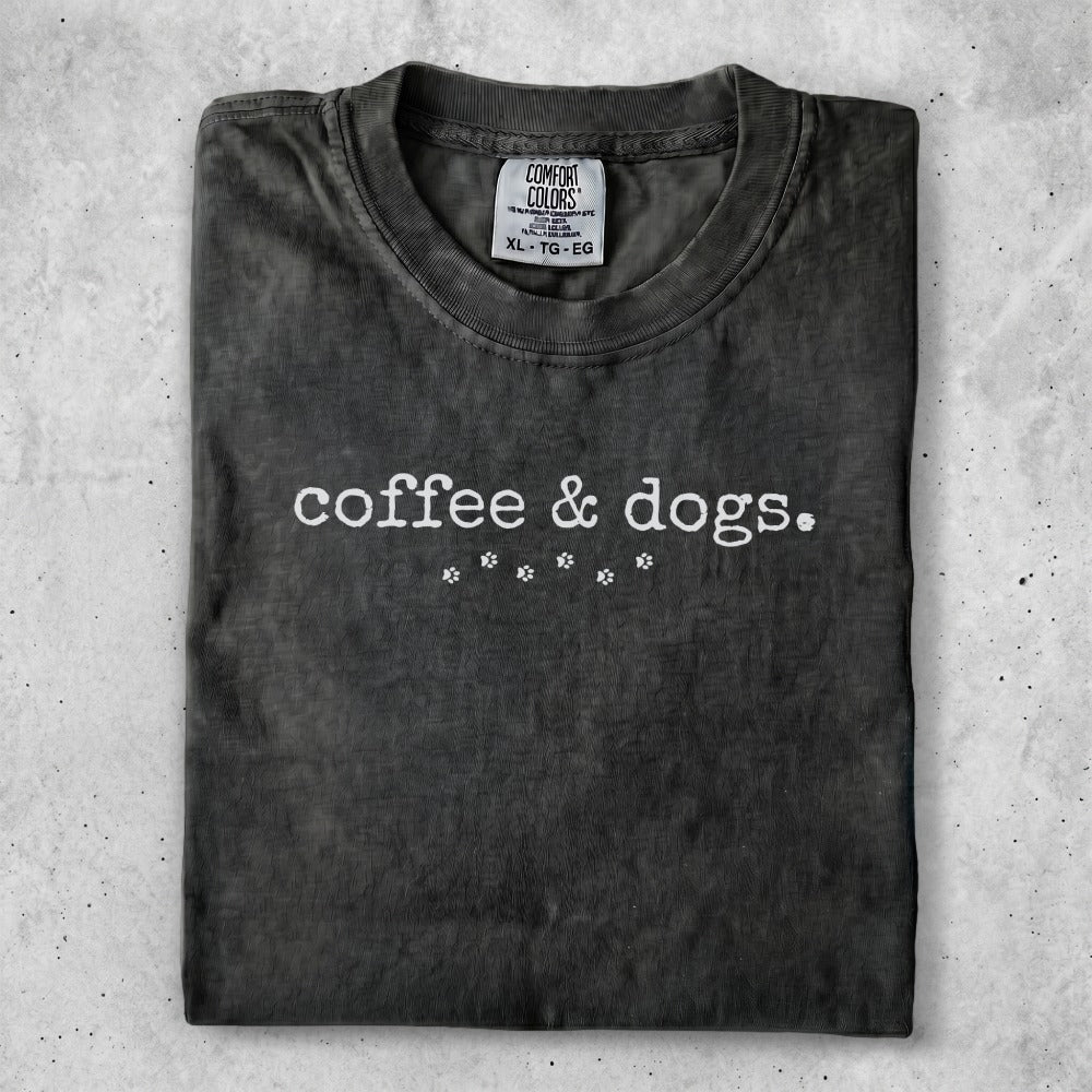 Dark gray t-shirt with "coffee & dogs." and paw prints graphic.