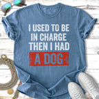 Blue t-shirt with distressed text "I USED TO BE IN CHARGE THEN I HAD A DOG".
