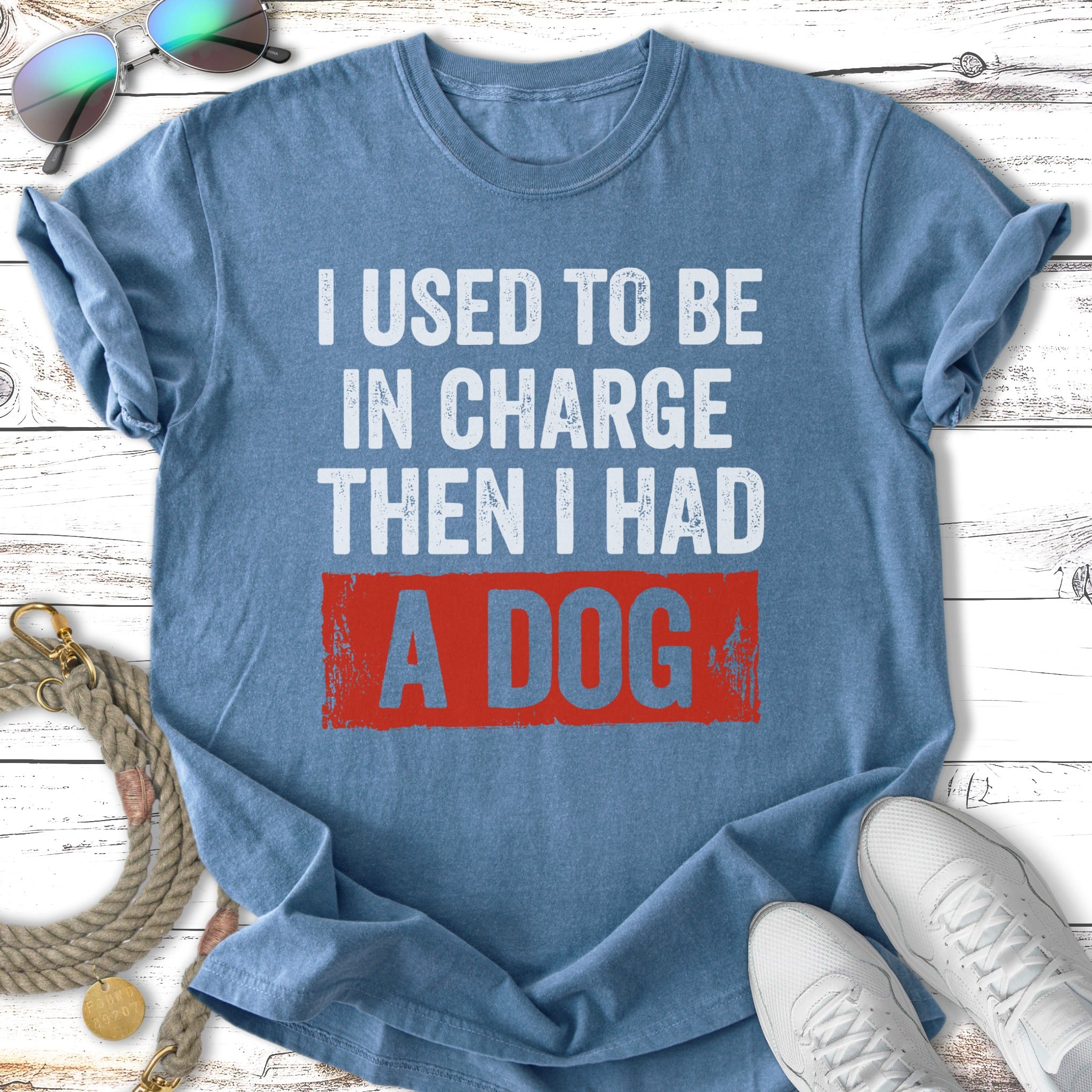 Blue t-shirt with distressed text "I USED TO BE IN CHARGE THEN I HAD A DOG".