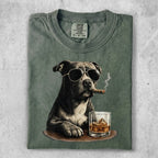 Pit bull wearing sunglasses and smoking cigar with whiskey.