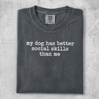 Comfort Colors t-shirt with "my dog has better social skills than me" text.