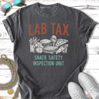 Distressed t-shirt with "LAB TAX SNACK SAFETY INSPECTION UNIT" and snack illustrations.