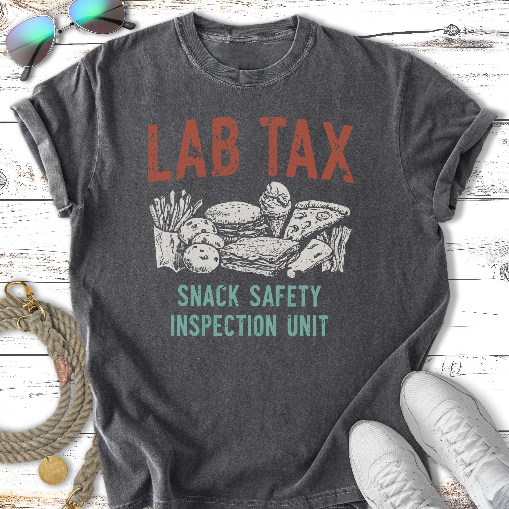 Distressed t-shirt with "LAB TAX SNACK SAFETY INSPECTION UNIT" and snack illustrations.