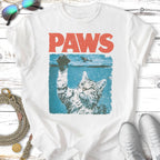 Cat in water with text "PAWS" above.