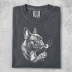 Dark grey t-shirt with a white sketch of a French bulldog blowing on a dandelion.