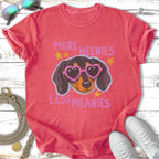 T-shirt with illustration of a dachshund wearing heart sunglasses, text reads "More Weenies Less Meanies."