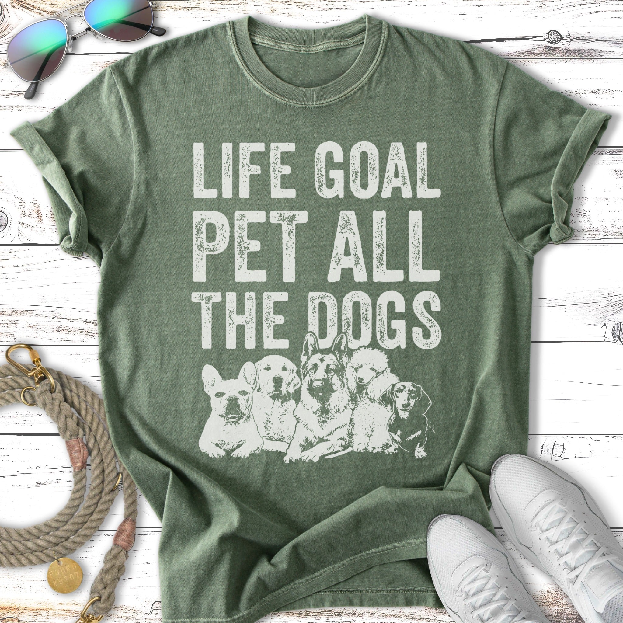 Green t-shirt with "LIFE GOAL PET ALL THE DOGS" text and five dogs.