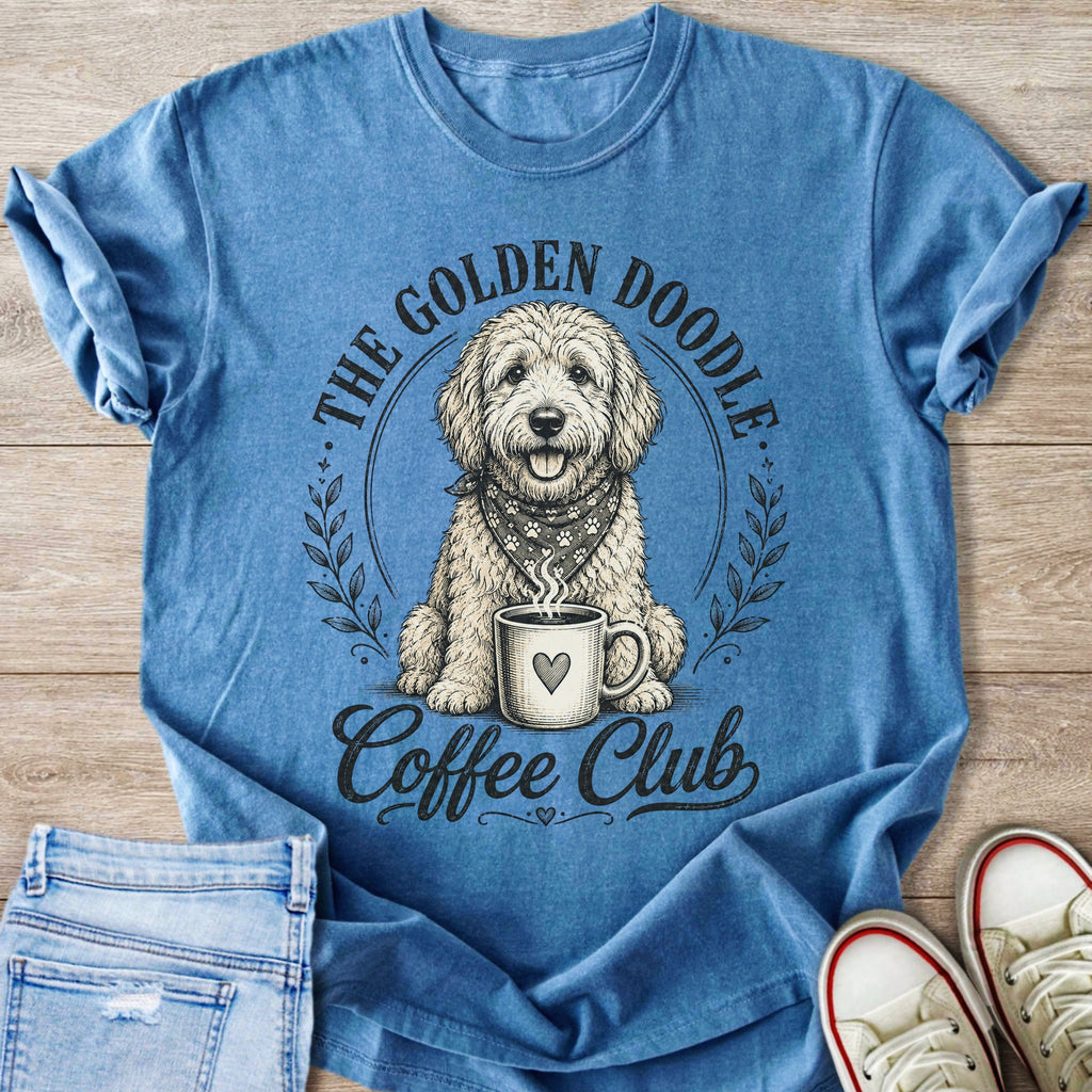 Blue t-shirt with a golden doodle dog wearing a bandana and holding a coffee cup.