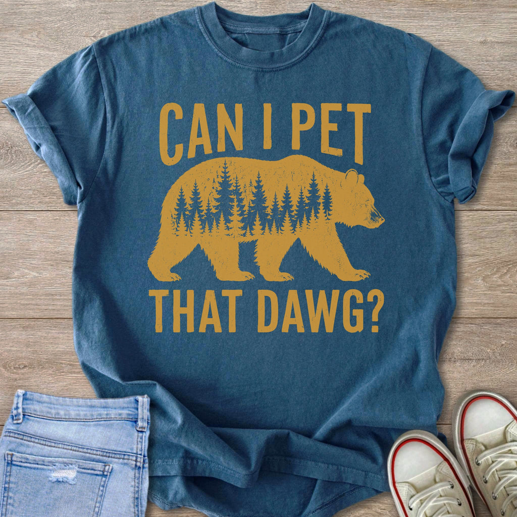 Blue t-shirt with golden printing of a bear and trees, and text "CAN I PET THAT DAWG?".