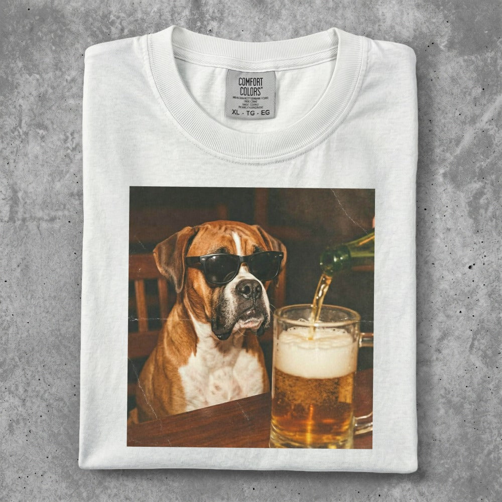 Boxer dog wearing sunglasses, with beer being poured into a mug.