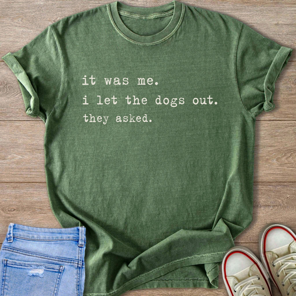 Green t-shirt with text "it was me. i let the dogs out. they asked."