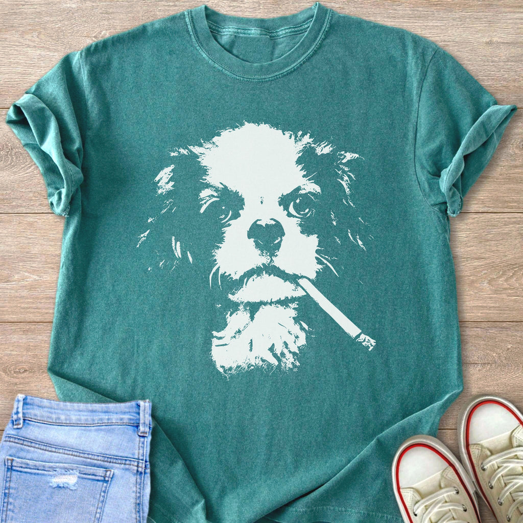 Teal t-shirt with white stencil of a dog holding a cigarette.