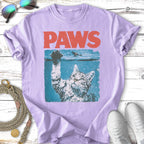 Cat reaching up from water with "PAWS" text above.