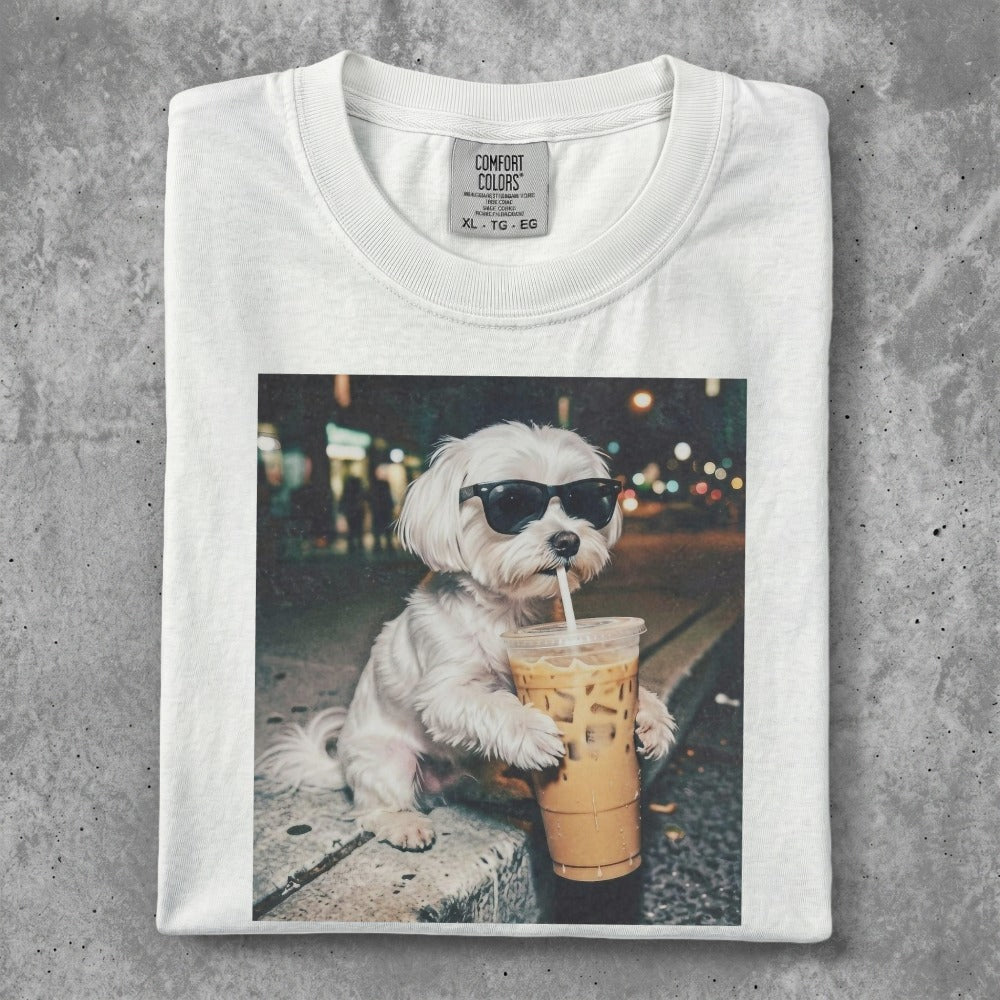 White t-shirt with a small white dog wearing sunglasses and drinking iced coffee.