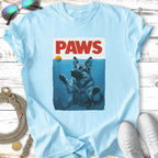 German Shepherd dog reaching out of water with "PAWS" text above.