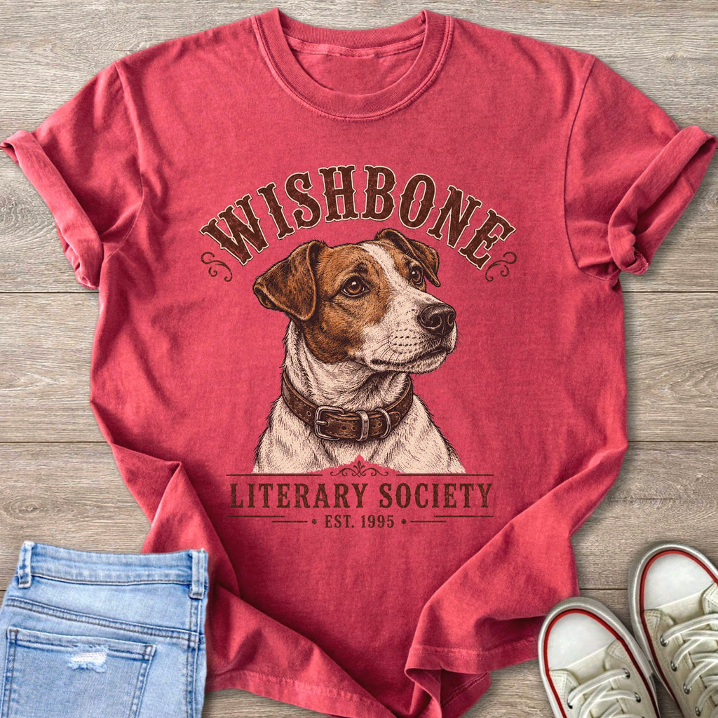 Red t-shirt with distressed Jack Russell terrier graphic and "Wishbone Literary Society Est. 1995" text.