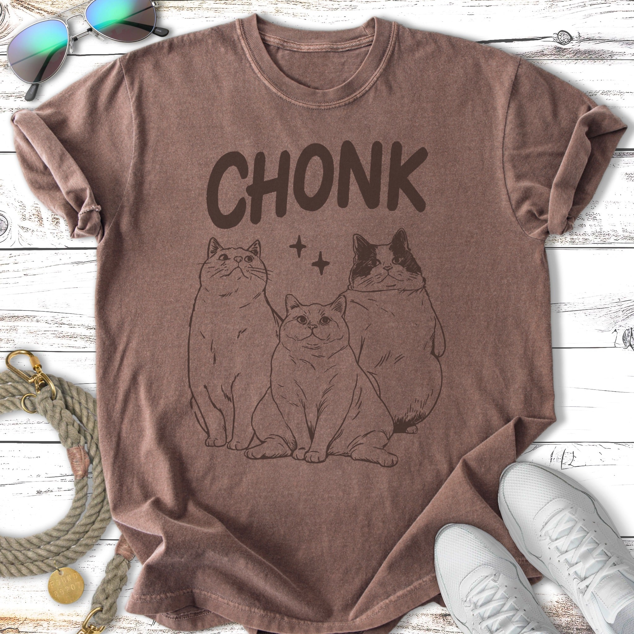 T-shirt featuring three cartoon cats with the text "CHONK".