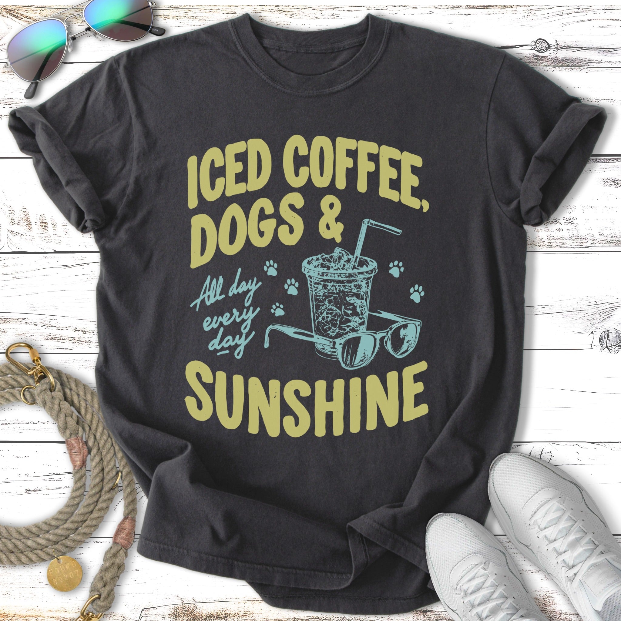 Dark t-shirt with text "Iced Coffee, Dogs & Sunshine" and illustration.