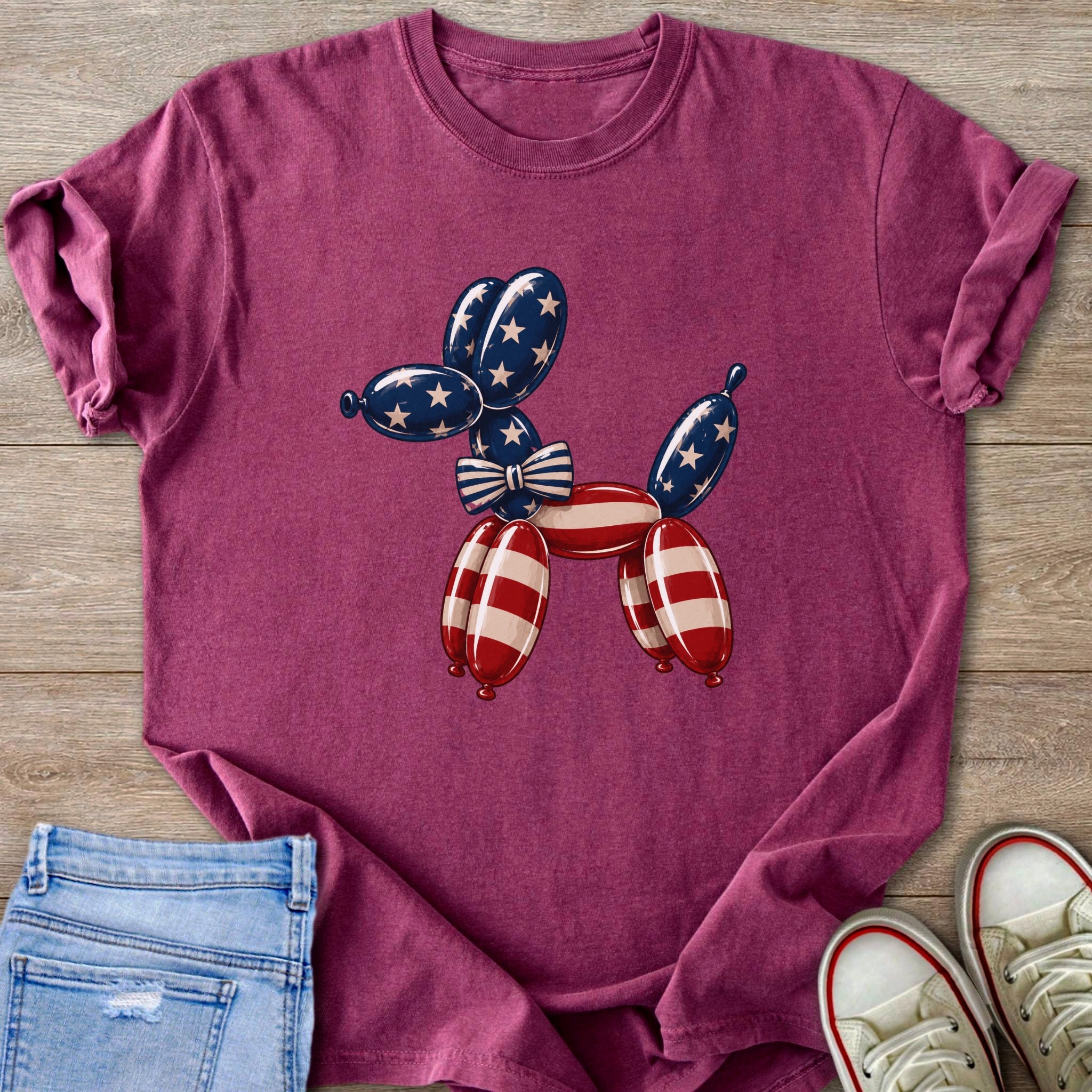 Burgundy t-shirt with a balloon dog graphic in American flag colors.