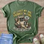 Green t-shirt with French bulldog print, "AT LEAST MY DOG THINKS I'M COOL", and "#1 HUMAN" mug.